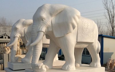 “企业大型景观汉白玉招财大象雕塑”是一种雕刻而成的…